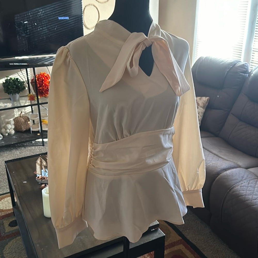 Beige blouse with peplum waist